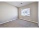 Neutral bedroom with carpet, a bright window, and minimalist design elements at 3693 Miguels Ln, Las Vegas, NV 89120