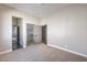 Bedroom with access to an ensuite bathroom and closet, carpeted for comfort at 3693 Miguels Ln, Las Vegas, NV 89120