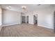 Large, neutral bedroom featuring wood-look floors and ample natural light through a large window at 3693 Miguels Ln, Las Vegas, NV 89120