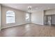Bright, open bedroom with stylish flooring, arched windows, and ample natural light at 3693 Miguels Ln, Las Vegas, NV 89120
