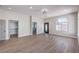 Spacious primary bedroom with wood floors and bathroom ensuite featuring modern sliding closet doors at 3693 Miguels Ln, Las Vegas, NV 89120