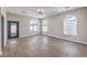 Large bedroom with sleek floors, arched windows, and access to the backyard through a glass door at 3693 Miguels Ln, Las Vegas, NV 89120