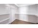 Walk-in closet with adjustable shelving and rods, offering ample storage space at 3693 Miguels Ln, Las Vegas, NV 89120