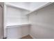 Walk-in closet with built-in shelving and hanging rods for organized storage at 3693 Miguels Ln, Las Vegas, NV 89120