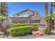 Attractive community entrance with decorative rock wall and lush landscaping at 3693 Miguels Ln, Las Vegas, NV 89120