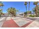 Gated community entrance with decorative landscaping and palm trees at 3693 Miguels Ln, Las Vegas, NV 89120