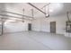 Spacious two-car garage with painted walls, concrete floor, and an insulated sectional door at 3693 Miguels Ln, Las Vegas, NV 89120