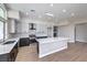 Bright kitchen featuring quartz countertops, an island, and stainless steel appliances at 3693 Miguels Ln, Las Vegas, NV 89120