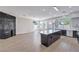 Open concept living space with an island, fireplace, and natural light at 3693 Miguels Ln, Las Vegas, NV 89120