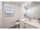 Clean half-bath features updated sink, vanity, mirror, lighting and natural light at 3821 Nesting Wren Dr, North Las Vegas, NV 89084