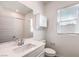 A clean bathroom with a single sink vanity, a bright window, and a shower/tub combo at 3821 Nesting Wren Dr, North Las Vegas, NV 89084
