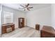Cozy bedroom featuring wood floors, natural light, and classic furnishings creating an inviting personal space at 3821 Nesting Wren Dr, North Las Vegas, NV 89084