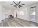 Spacious bonus room with wood flooring, a ceiling fan, and natural light, perfect for work or relaxation at 3821 Nesting Wren Dr, North Las Vegas, NV 89084