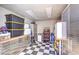 Garage features ample storage space, with cabinets, shelving, and checkerboard flooring at 3821 Nesting Wren Dr, North Las Vegas, NV 89084