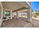 A covered patio with pavers, providing shade and a space for outdoor living and dining at 3821 Nesting Wren Dr, North Las Vegas, NV 89084