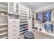 Custom walk-in closet with ample shelving, drawers, and hanging space for optimal storage and organization at 3821 Nesting Wren Dr, North Las Vegas, NV 89084