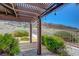 Landscaped backyard with patio, pergola, and mountain views at 454 Intrepid Ct, Boulder City, NV 89005
