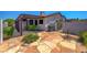 Cozy backyard featuring a covered patio and a stone-paved area, ideal for outdoor relaxation at 454 Intrepid Ct, Boulder City, NV 89005