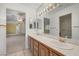 Well-lit bathroom with dual sinks, and a vanity with wooden cabinets at 454 Intrepid Ct, Boulder City, NV 89005