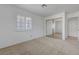 Bright bedroom features mirrored closet doors and a window with white shutters at 454 Intrepid Ct, Boulder City, NV 89005