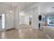 Inviting foyer featuring tile flooring, chandelier, and an open layout leading to the living and dining areas at 454 Intrepid Ct, Boulder City, NV 89005
