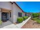 View of landscaped front yard with desert plants, rocks, and exterior of the house at 454 Intrepid Ct, Boulder City, NV 89005
