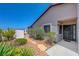 View of landscaped front yard with desert plants, rocks, and exterior of the house at 454 Intrepid Ct, Boulder City, NV 89005