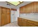 Bright kitchen featuring ample storage with wooden cabinets and a white refrigerator at 454 Intrepid Ct, Boulder City, NV 89005