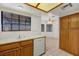 Charming kitchen showcasing wood cabinetry, tile countertops, and modern appliances at 454 Intrepid Ct, Boulder City, NV 89005