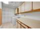 Laundry room with washer, dryer, shelving and storage cabinets at 454 Intrepid Ct, Boulder City, NV 89005