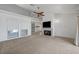 Bright living room with carpet, fireplace, and windows at 454 Intrepid Ct, Boulder City, NV 89005