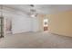 Spacious main bedroom features neutral carpeting and adjoins a bathroom at 454 Intrepid Ct, Boulder City, NV 89005