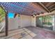 Covered patio featuring stone flooring, ceiling fan and sliding glass door at 454 Intrepid Ct, Boulder City, NV 89005