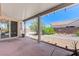 Covered patio overlooking a low maintenance backyard with decorative gravel and hardscape at 4724 Victoria Beach Way, Las Vegas, NV 89130