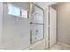 This is a tub with a glass door and a tiled wall at 4724 Victoria Beach Way, Las Vegas, NV 89130