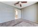 Bedroom with carpeted floors leads to an ensuite bathroom, complete with tiled flooring at 4724 Victoria Beach Way, Las Vegas, NV 89130