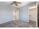 Bedroom boasts carpet floors, ensuite bathroom, and a walk-in closet with shelving at 4724 Victoria Beach Way, Las Vegas, NV 89130