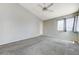 Bedroom features carpet floors, a ceiling fan, and a door to the outside, offering comfort and convenience at 4724 Victoria Beach Way, Las Vegas, NV 89130