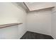 Walk-in closet featuring a carpeted floor, wooden support beams, and a shelf at 4724 Victoria Beach Way, Las Vegas, NV 89130