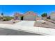Charming single-story home with desert landscaping and a two-car garage at 4724 Victoria Beach Way, Las Vegas, NV 89130