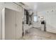 Unfinished garage with a sink, storage cabinets, and a water filtration system at 4724 Victoria Beach Way, Las Vegas, NV 89130