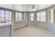 Bright kitchen featuring tile countertops, wood cabinets, tile floors, and stainless steel appliances at 4724 Victoria Beach Way, Las Vegas, NV 89130