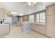 Bright kitchen featuring tile countertops, wood cabinets, tile floors, and stainless steel appliances at 4724 Victoria Beach Way, Las Vegas, NV 89130