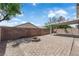 Spacious backyard featuring an outdoor firepit and a covered patio for relaxing outdoors at 5001 Morning Falls Ave, Las Vegas, NV 89131