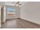 Cozy bedroom with wood flooring, ceiling fan and natural light at 5001 Morning Falls Ave, Las Vegas, NV 89131