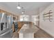 Spacious kitchen with a large island, stainless steel appliances, and wood cabinetry under recessed and pendant lighting at 5001 Morning Falls Ave, Las Vegas, NV 89131