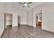 Spacious main bedroom suite with wood flooring and multiple doorways at 5001 Morning Falls Ave, Las Vegas, NV 89131