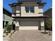 Modern two-story home with a two-car garage, neutral paint, and stone accents at 514 Red Lovebird Ave # Lot 1241, Henderson, NV 89011