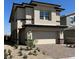 Two-story home with a brick driveway, two-car garage, and desert landscaping at 514 Red Lovebird Ave # Lot 1241, Henderson, NV 89011