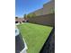 Expansive artificial turf backyard complemented by an inviting patio, perfect for enjoying outdoor living at 5414 Enchanted Rose St, Las Vegas, NV 89148